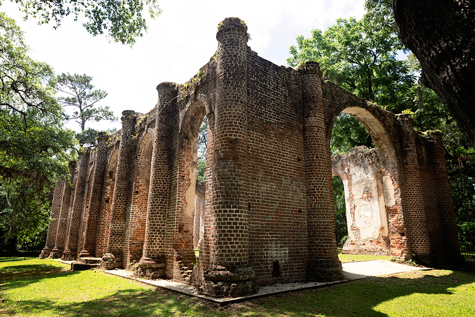 Natural overgrowth covering an old brick structure
