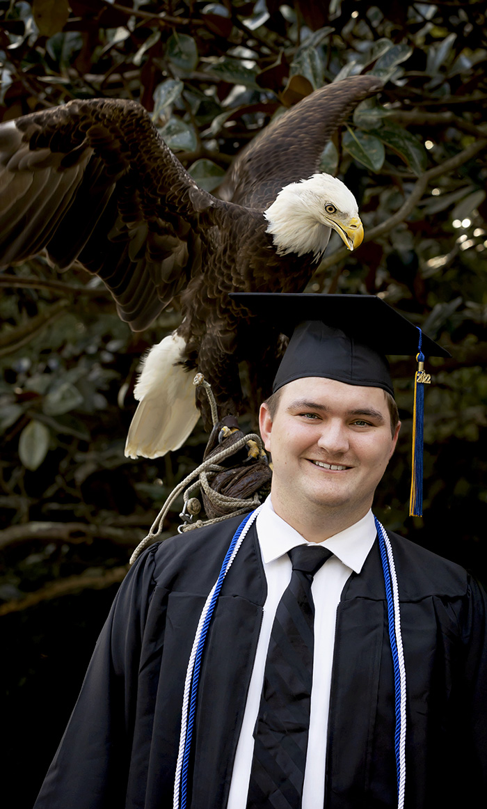 Graduate student portrait with eagle in the background