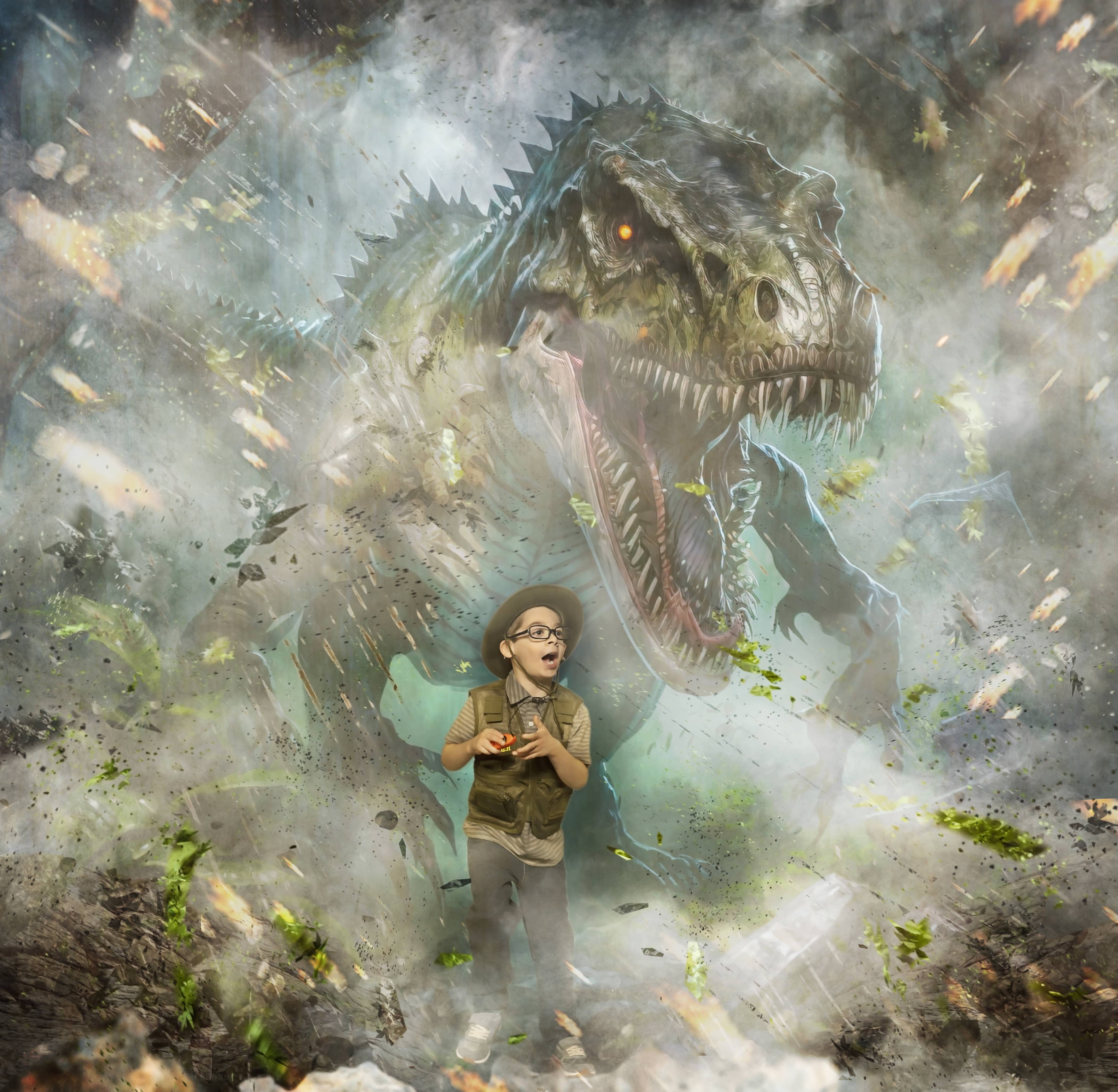 Boy in an explorer costume with a dinosaur in the background